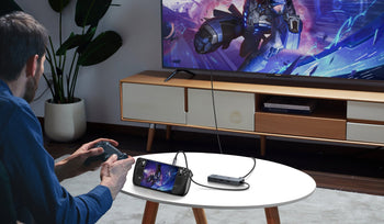 UGREEN docking station connecting a handheld gaming console to a TV for living room gaming