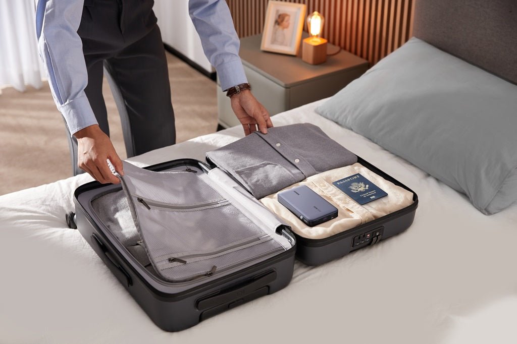UGREEN power bank packed in a suitcase for business travel charging