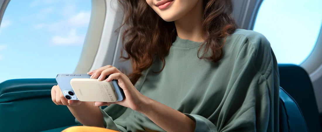 UGREEN MagSafe power bank charging an iPhone during a flight