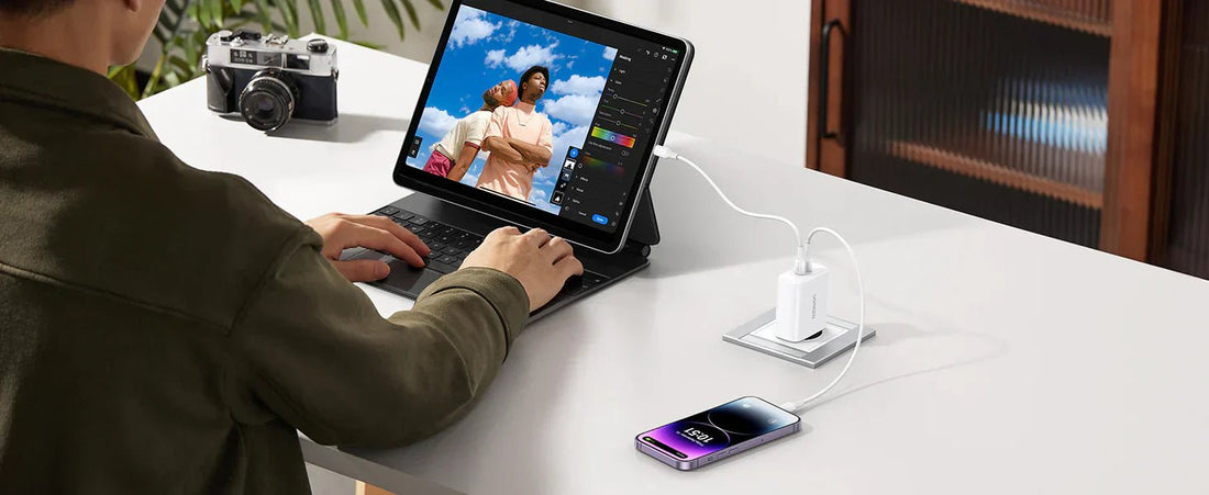 Phone charging via a fast charger while working on a tablet at a desk