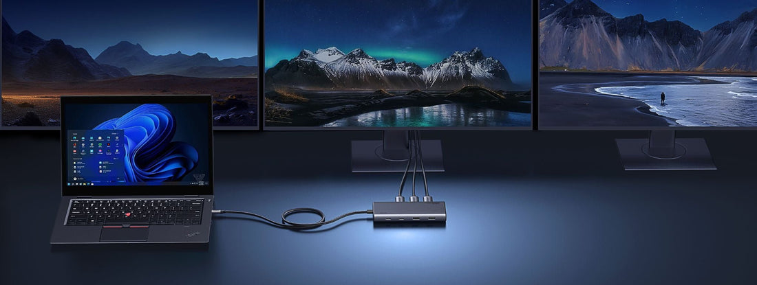 Laptop connected to three external monitors through a USB-C docking station
