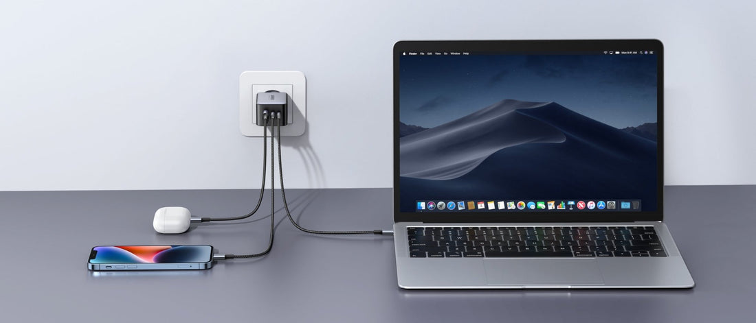 Multi-port USB charger powering a laptop, smartphone and wireless earbuds